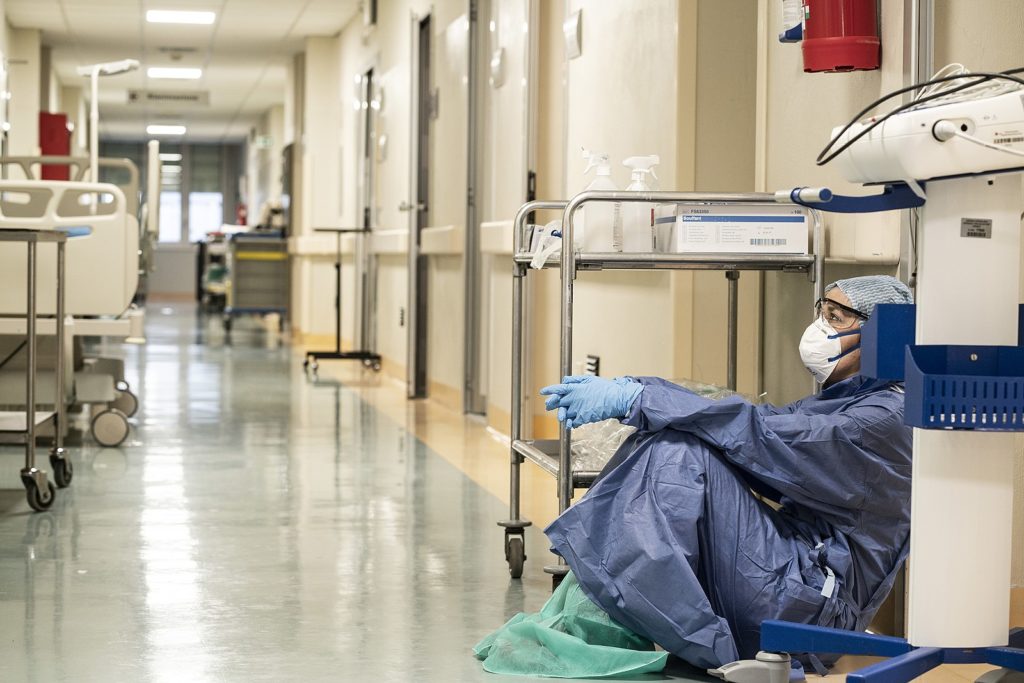 Italian nurse slumped over after a COVID shift at the hospital