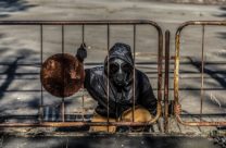 Stalker emerges from a manhole around Chernobyl