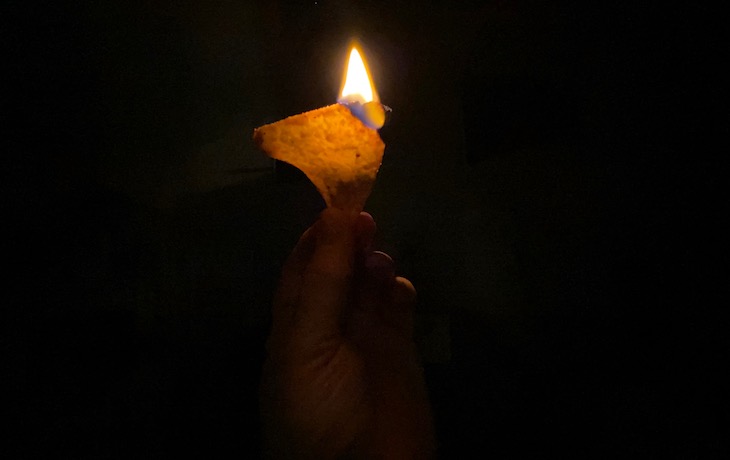 A Dorito on fire in the dark