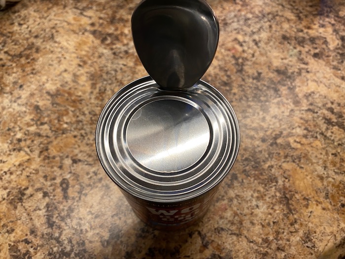 Opening a can with a spoon
