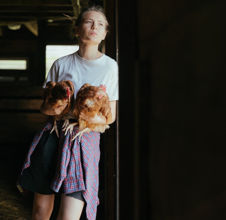 Lady holding chickens