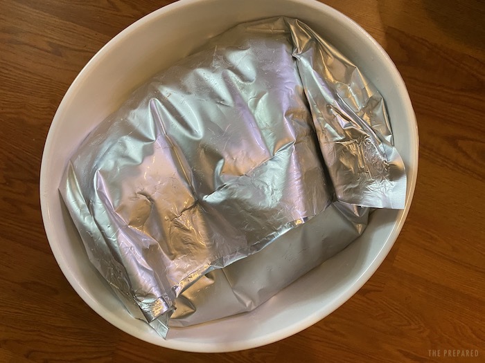 Mylar bag stuffed into a five-gallon bucket