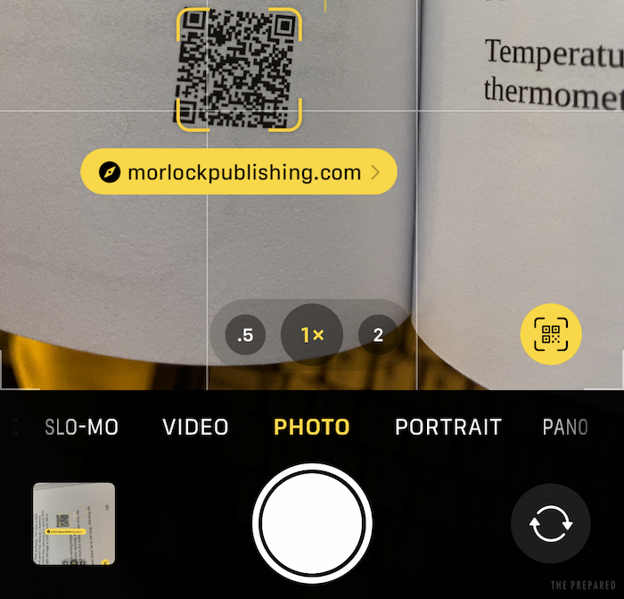 Scanning a QR code in the book with the iOS 15 Photos app