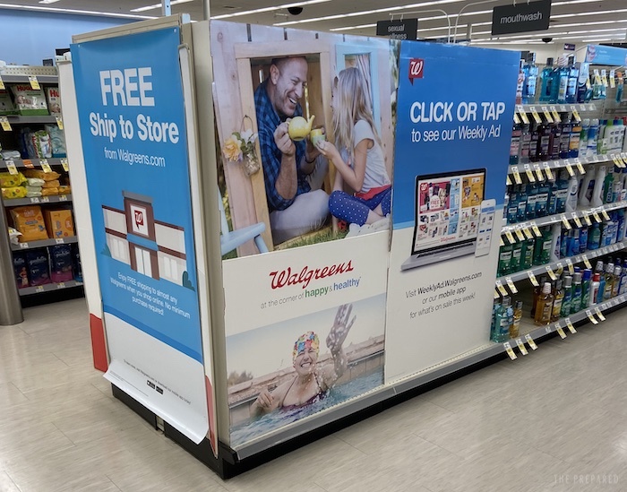 A Walgreens using posters to cover empty shelves