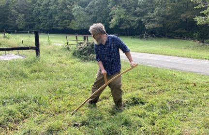 The author scything his yard